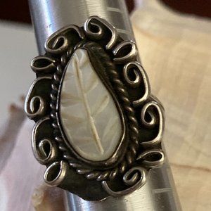 Stunning leaf-shaped mother of pearl gem in filigreed sterling silver setting